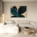 A modern living room with a beige sectional sofa, neutral walls, a wooden coffee table with books and a bowl, and Deep Navy Abstract Canvas Art above the couch. Sheer curtains let in light, enhancing the room’s elevated decor.