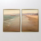 The "Pier Dreams - Set of 2" features framed coastal canvas prints showing a tranquil beach, gentle waves, and a hazy sky. These warm-toned pieces bring Nordic Park-inspired serenity and dreamy charm to your space.