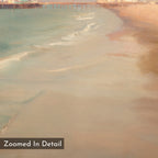 Experience the serene beauty of "Pier Dreams Canvas Art - Square," featuring a sandy beach, gentle waves, and a wooden pier from above with a soft, painterly effect. Includes zoomed-in detail in the bottom left—ideal as dreamy coastal wall art.
