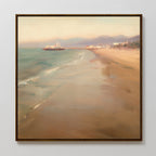 Pier Dreams Canvas Art - Square features a framed coastal scene with a sandy beach, gentle waves, a pier extending into the ocean, distant buildings, and pastel hues for a calm, dreamy wall art accent.