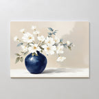 Porcelain Dreams Canvas Art - Horizontal features white flowers with green leaves in a round blue vase, set against a light beige background—an exquisite touch of floral artistry for any space.