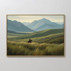 The Prairie Wanderer Canvas Art - Horizontal showcases a lone rider on horseback traveling through tall grass in a wide green valley, with rolling hills and blue peaks—an impressive western wall accent for any room.