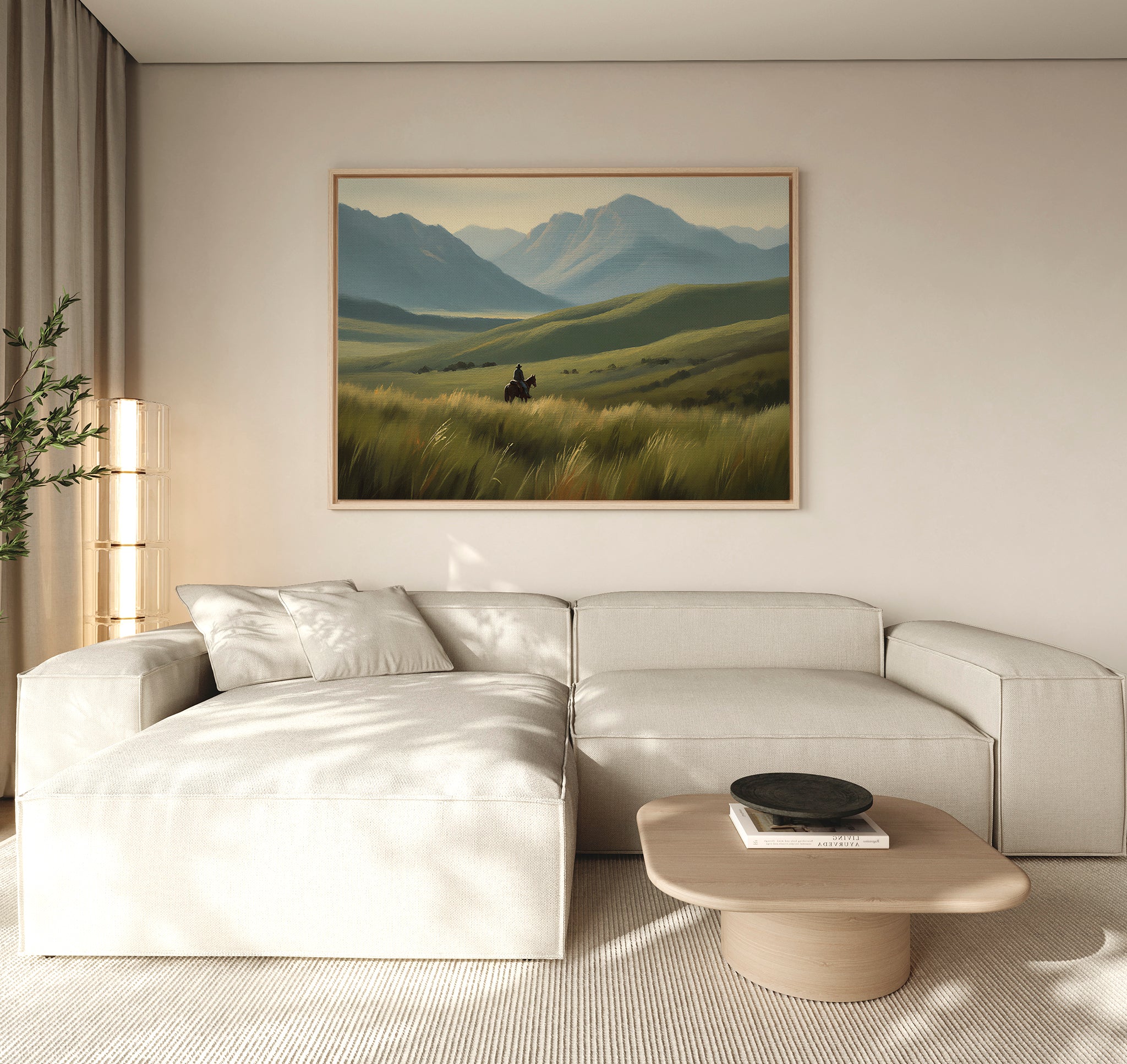 A modern living room features a light beige sectional, wooden coffee table, and the Prairie Wanderer Canvas Art - Horizontal above the couch. A tall plant near sheer curtains adds prairie decor flair to the space.