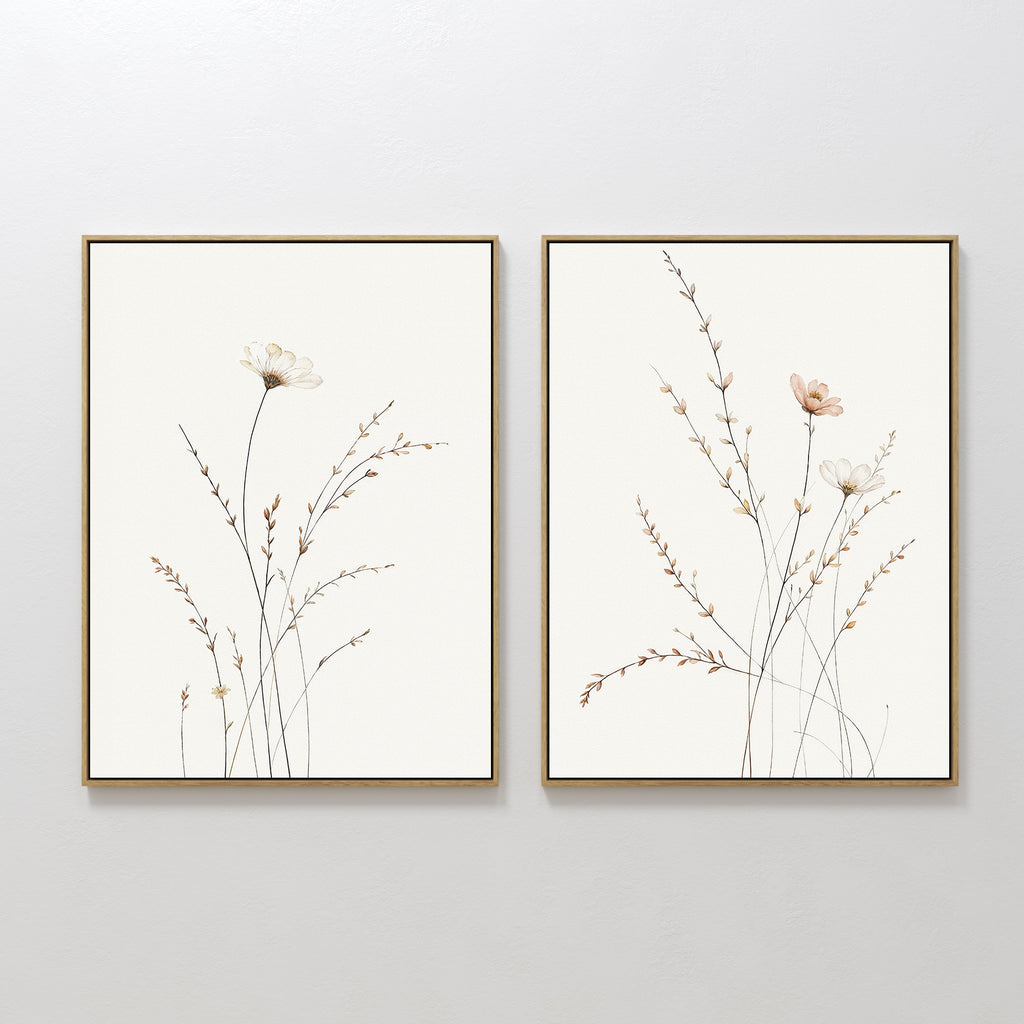 Prairie Whispers - Set of 2 features framed botanical wall art with delicate wildflowers and slender stems in soft, neutral tones, hung side by side—ideal for a Nordic Park-inspired space.