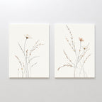 Prairie Whispers - Set of 2: Minimalist botanical wall art prints featuring delicate wildflowers and slender grasses on white, ideal for creating a serene Nordic Park vibe in your space.