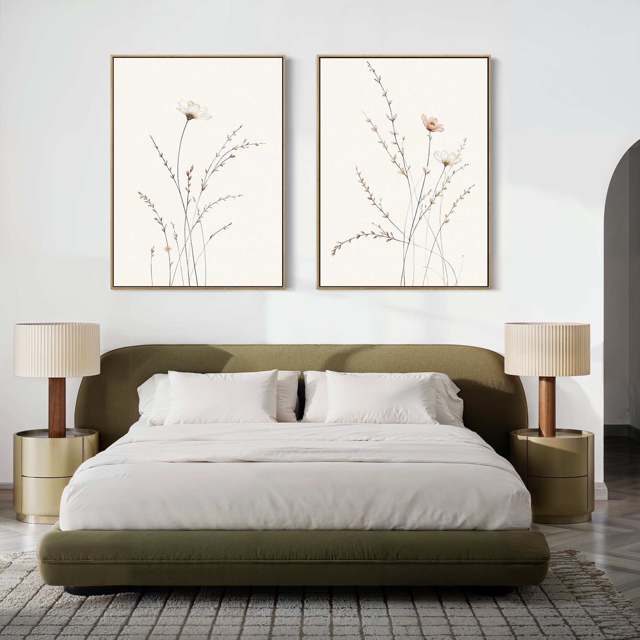 A modern bedroom featuring an olive green upholstered bed with white bedding, two round nightstands with beige lamps, and Prairie Whispers - Set of 2 botanical wall art prints above the bed on a white wall.