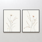 Prairie Whispers - Set of 2: Framed minimalist botanical wall art prints with delicate flowers and slender stems on white backgrounds, ideal for adding a Nordic Park touch to your space.