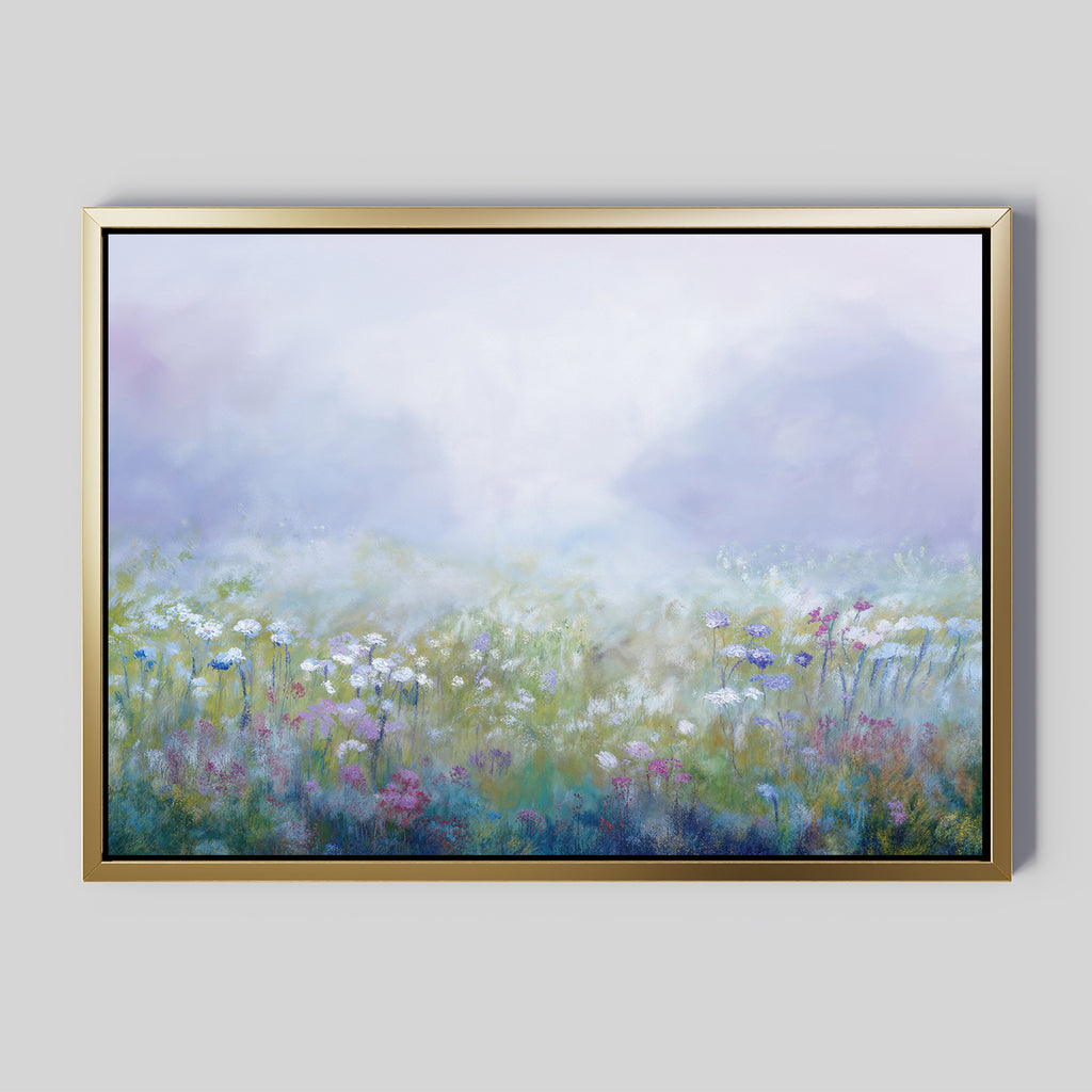 Add dreamy tranquility to your living room with the Purple Haze Canvas Art - Horizontal, featuring a framed print of a misty meadow filled with white, pink, and purple wildflowers beneath a soft, hazy sky.
