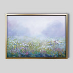 Add dreamy tranquility to your living room with the Purple Haze Canvas Art - Horizontal, featuring a framed print of a misty meadow filled with white, pink, and purple wildflowers beneath a soft, hazy sky.