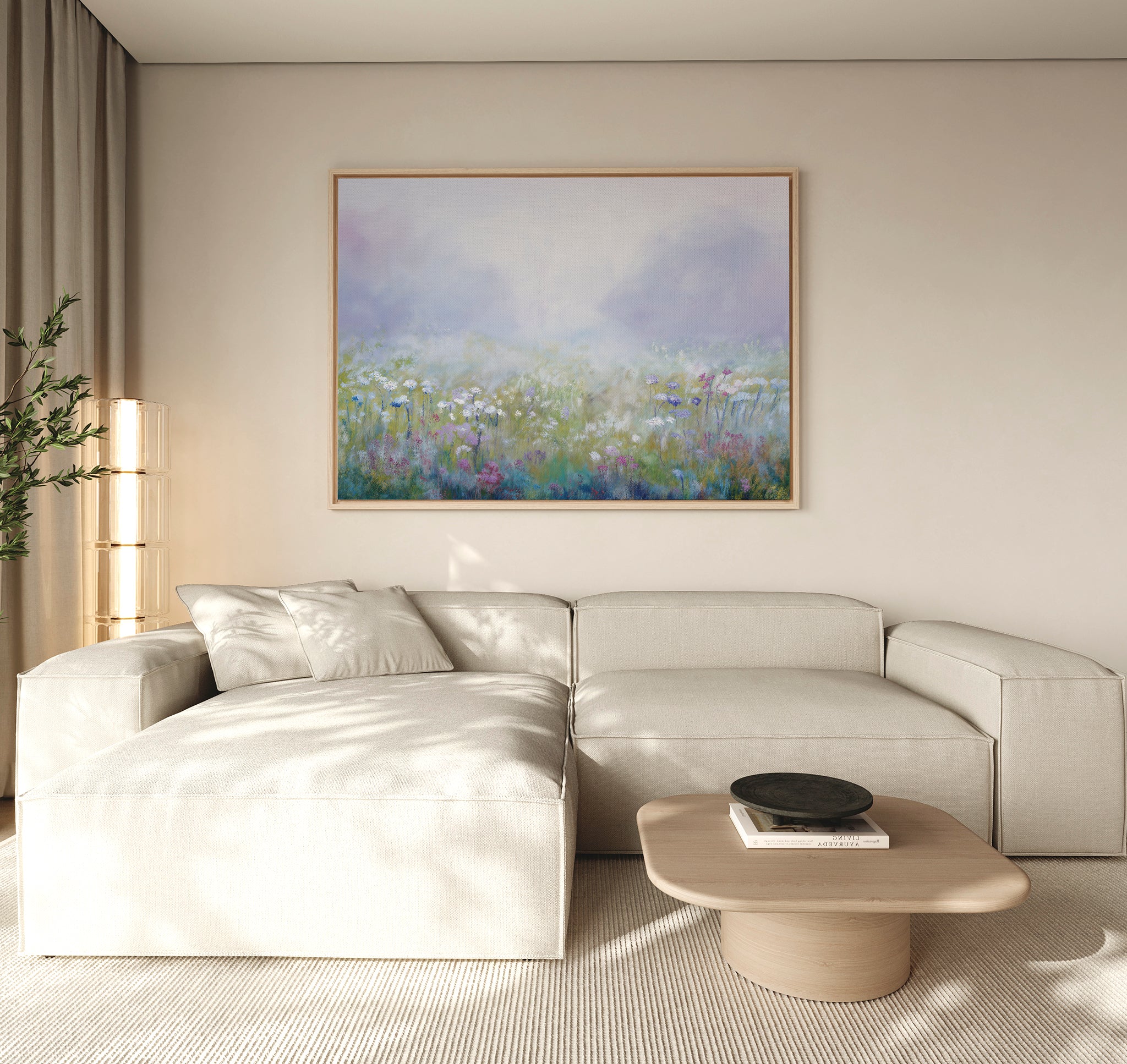 A modern living room features a large cream sectional sofa, a light wood coffee table with a black bowl, and the Purple Haze Canvas Art - Horizontal framed above the sofa. Neutral tones and natural light complete the elegant decor.