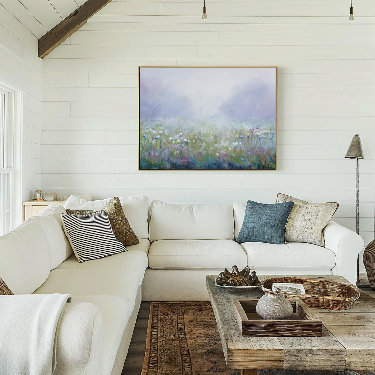 Brighten your space with the Purple Haze Canvas Art - Horizontal, paired with a cream sectional, neutral and blue pillows, rustic wood coffee table, and white shiplap walls—an elegant touch to elevate your living room decor.
