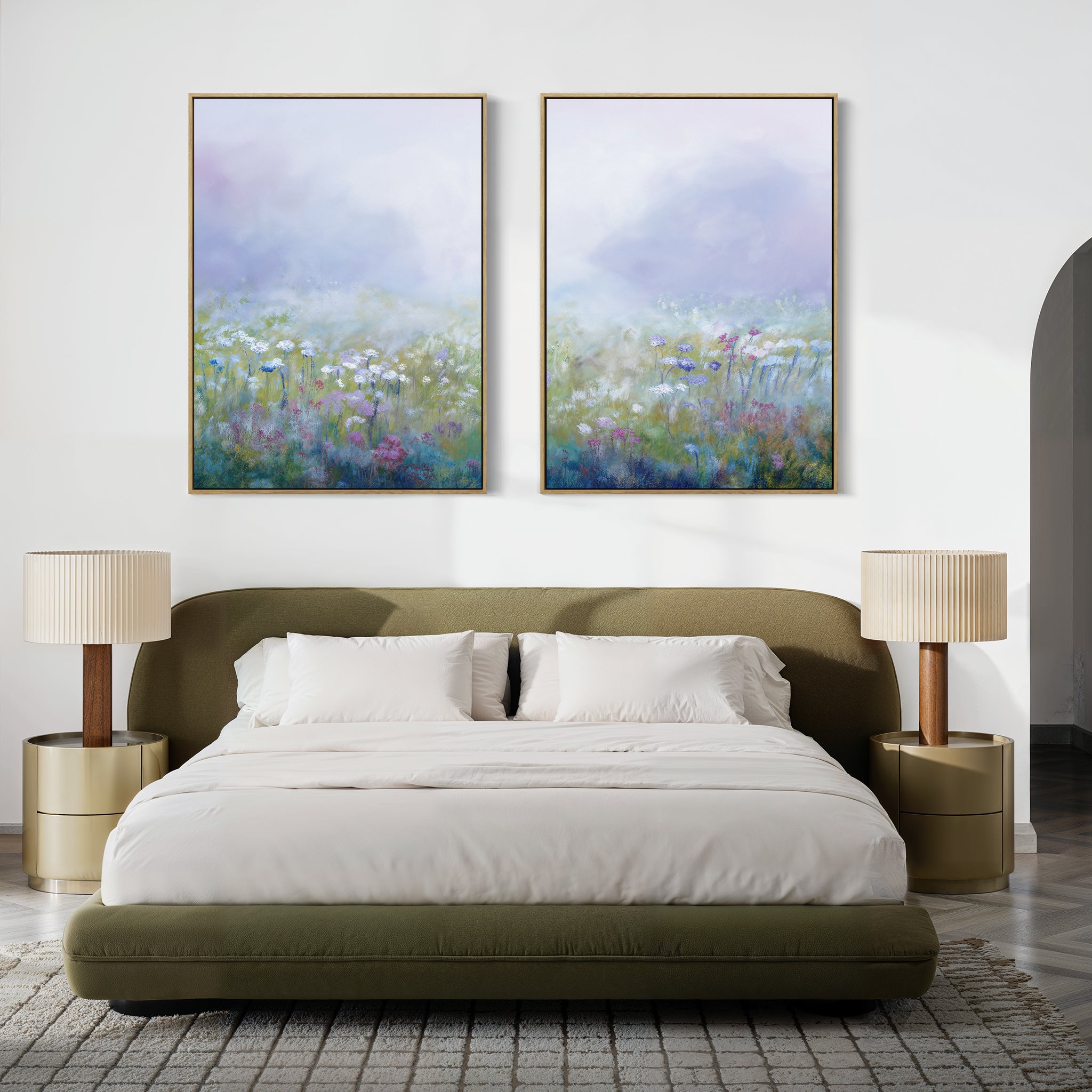 A modern bedroom featuring an olive green bed, white bedding, beige nightstands with matching lamps, and the "Purple Haze - Set of 2" large pastel floral canvas prints above the bed—ideal for stylish bedroom decor.