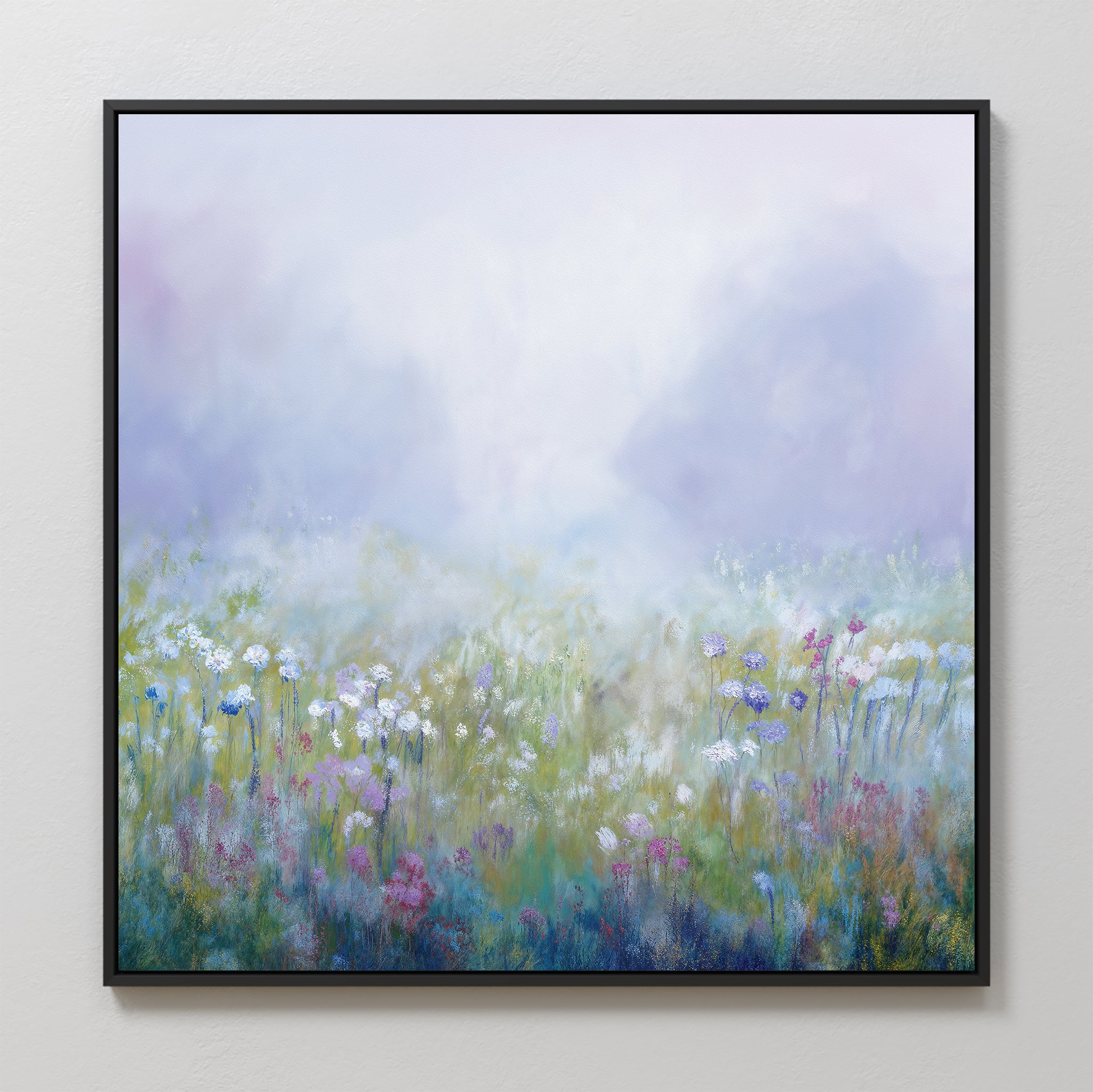 Purple Haze Canvas Art - Square: a framed print of a misty meadow with pastel purple, blue, pink, and green wildflowers beneath a hazy sky. Ideal for bedroom decor or bringing tranquility to your living space.