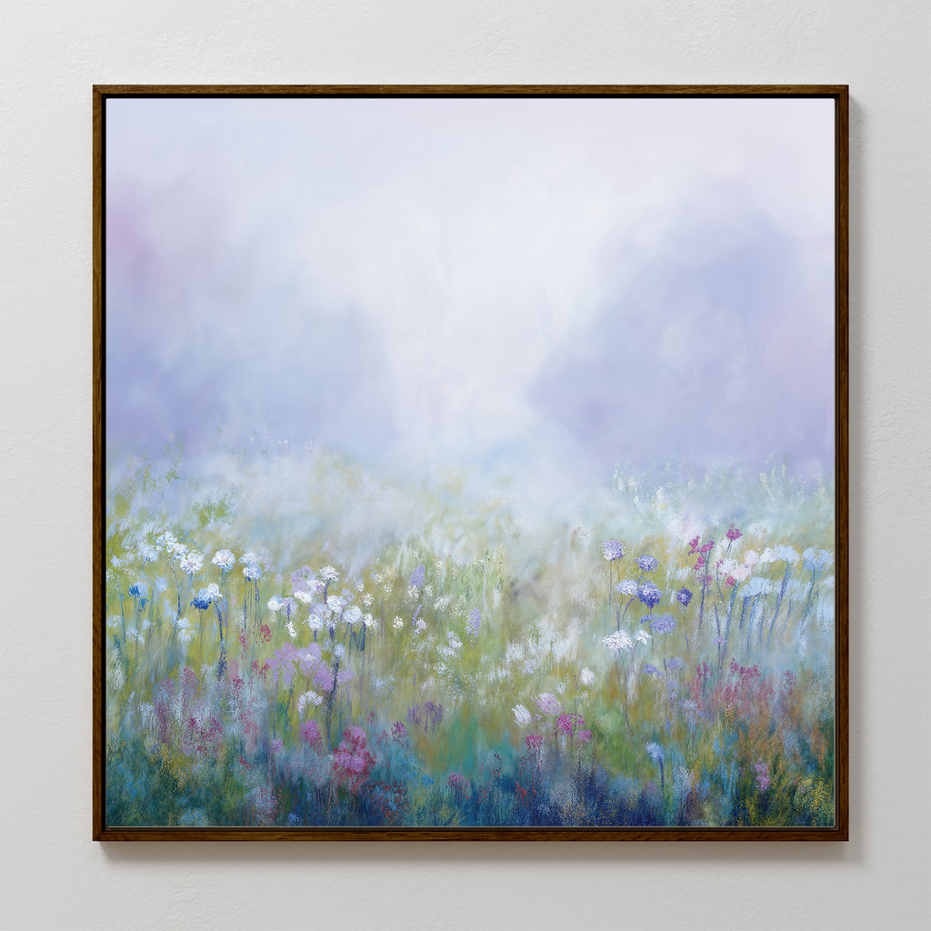 The Purple Haze Canvas Art - Square features a misty meadow with soft pastel tones and blooming wildflowers in white, purple, and pink—a dreamy, serene addition to your living room decor.