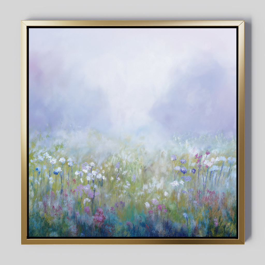 Purple Haze Canvas Art - Square: Framed canvas of a misty wildflower meadow with soft pastel hues and scattered white, purple, and pink blooms under a hazy purple-blue sky—an elegant addition to your living room decor.