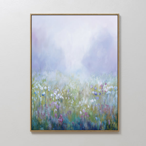 The Purple Haze Canvas Art - Vertical features a framed print of a misty meadow with white, pink, and purple wildflowers against a dreamy background—an ideal piece to add charm to your living room decor.