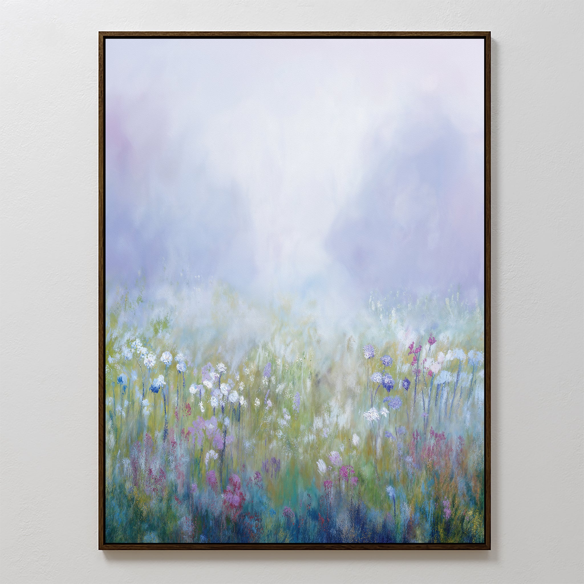 Purple Haze Canvas Art - Vertical features a dreamy, misty meadow with wildflowers in soft purple, blue, white, and pink tones against a pale sky—perfect as serene framed canvas decor for your living room.