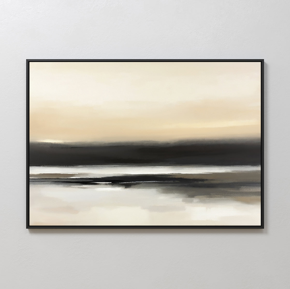 Quiet Shoreline Canvas Art - Horizontal features a serene abstract coastal scene in soft beige, cream, gray, and black. Framed in thin black, this minimalist wall art evokes a calm horizon and reflection on a light-colored wall.