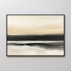 Quiet Shoreline Canvas Art - Horizontal features a serene abstract coastal scene in soft beige, cream, gray, and black. Framed in thin black, this minimalist wall art evokes a calm horizon and reflection on a light-colored wall.