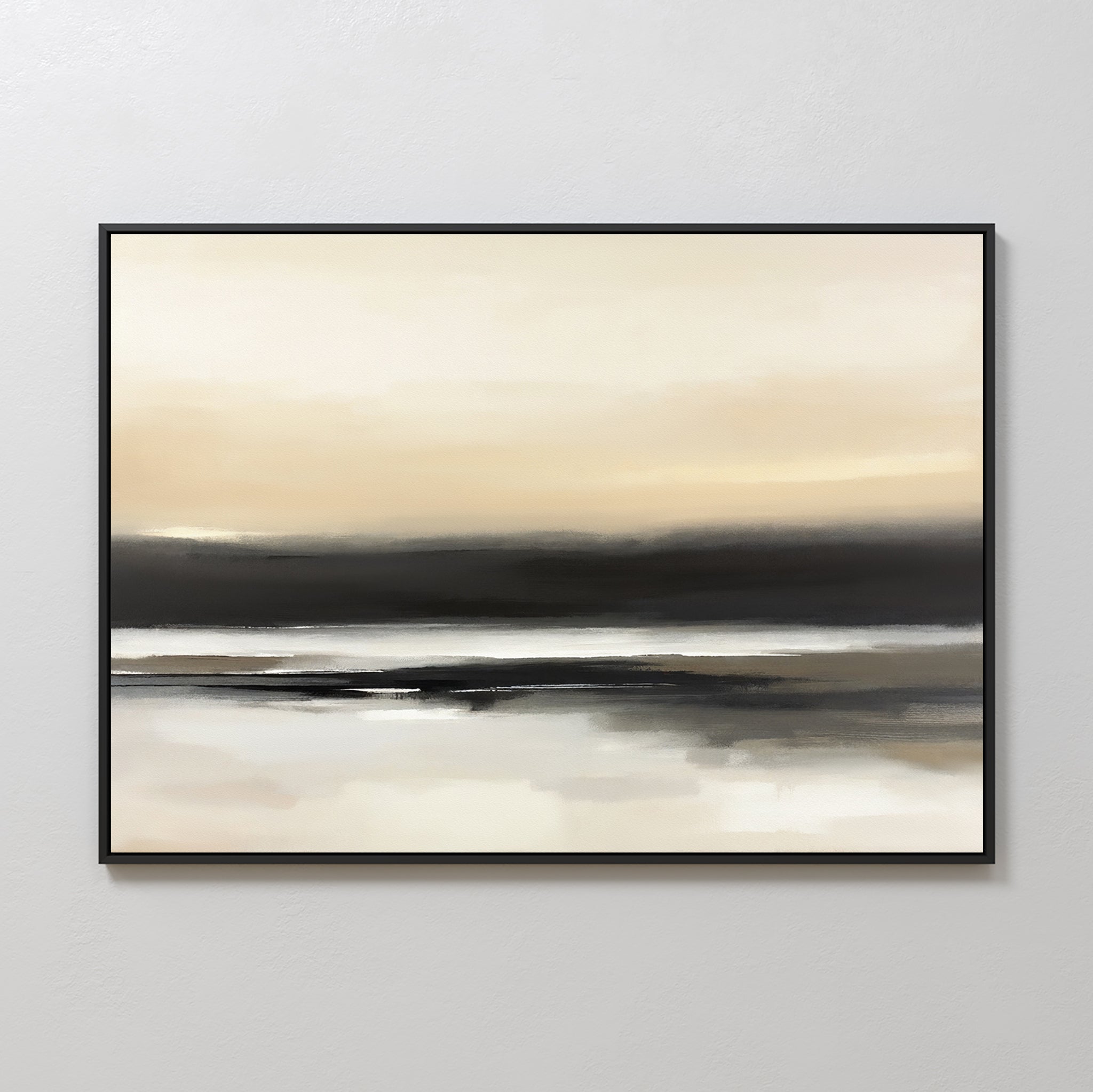 Quiet Shoreline Canvas Art - Horizontal features a serene abstract coastal scene in soft beige, cream, gray, and black. Framed in thin black, this minimalist wall art evokes a calm horizon and reflection on a light-colored wall.