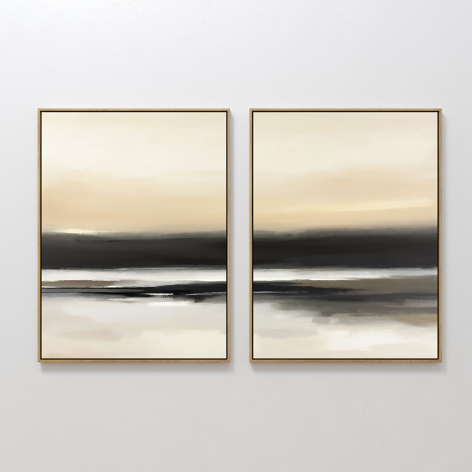 The Quiet Shoreline - Set Of 2 features framed abstract coastal wall art with soft, blurred bands of beige, cream, black, and gray. Displayed together, they evoke a serene seascape and add minimalist elegance to any space.