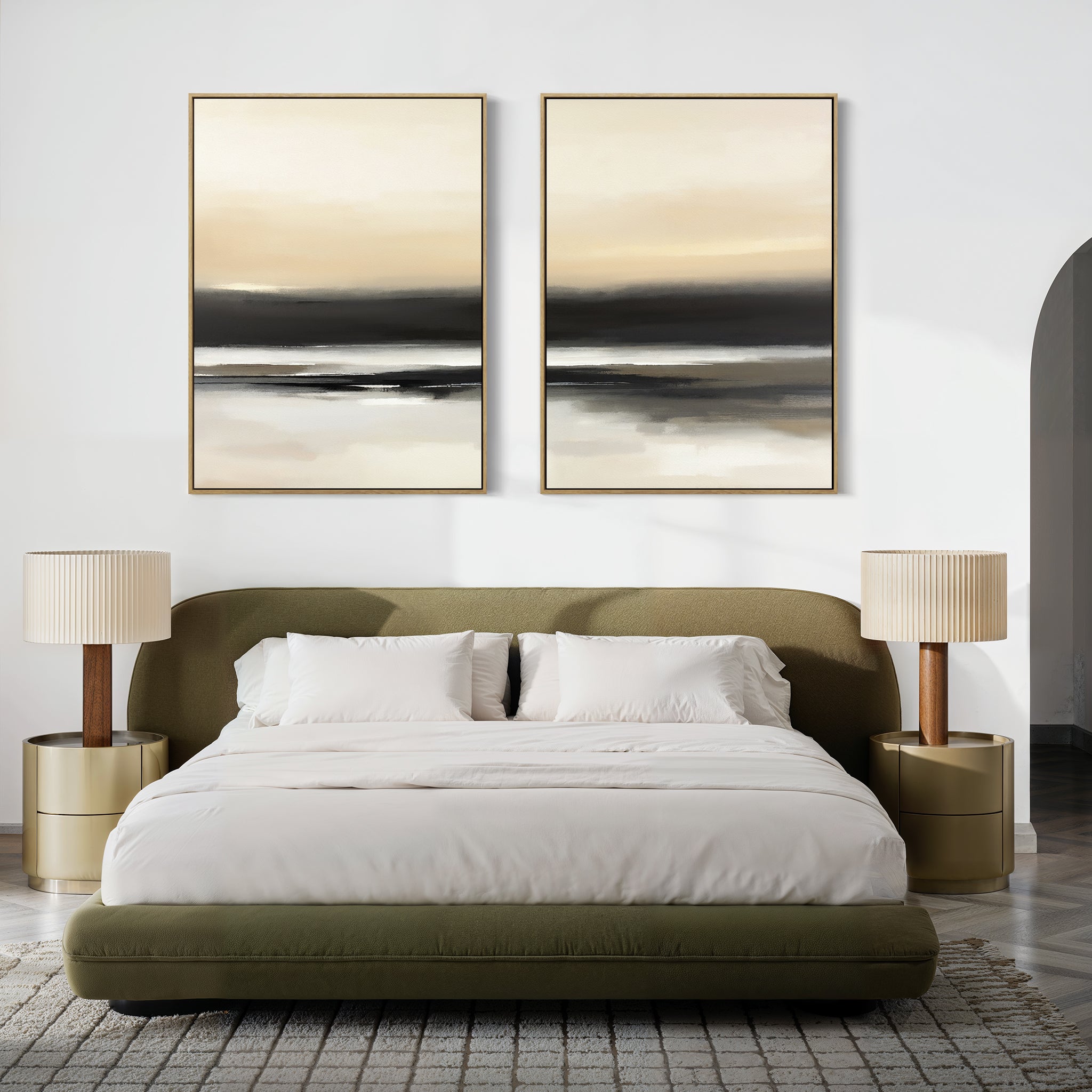 A modern bedroom features an olive green bed, white bedding, gold nightstands with beige lamps, and the "Quiet Shoreline - Set Of 2" artwork above the headboard. Neutral tones and a textured rug complete the serene atmosphere.