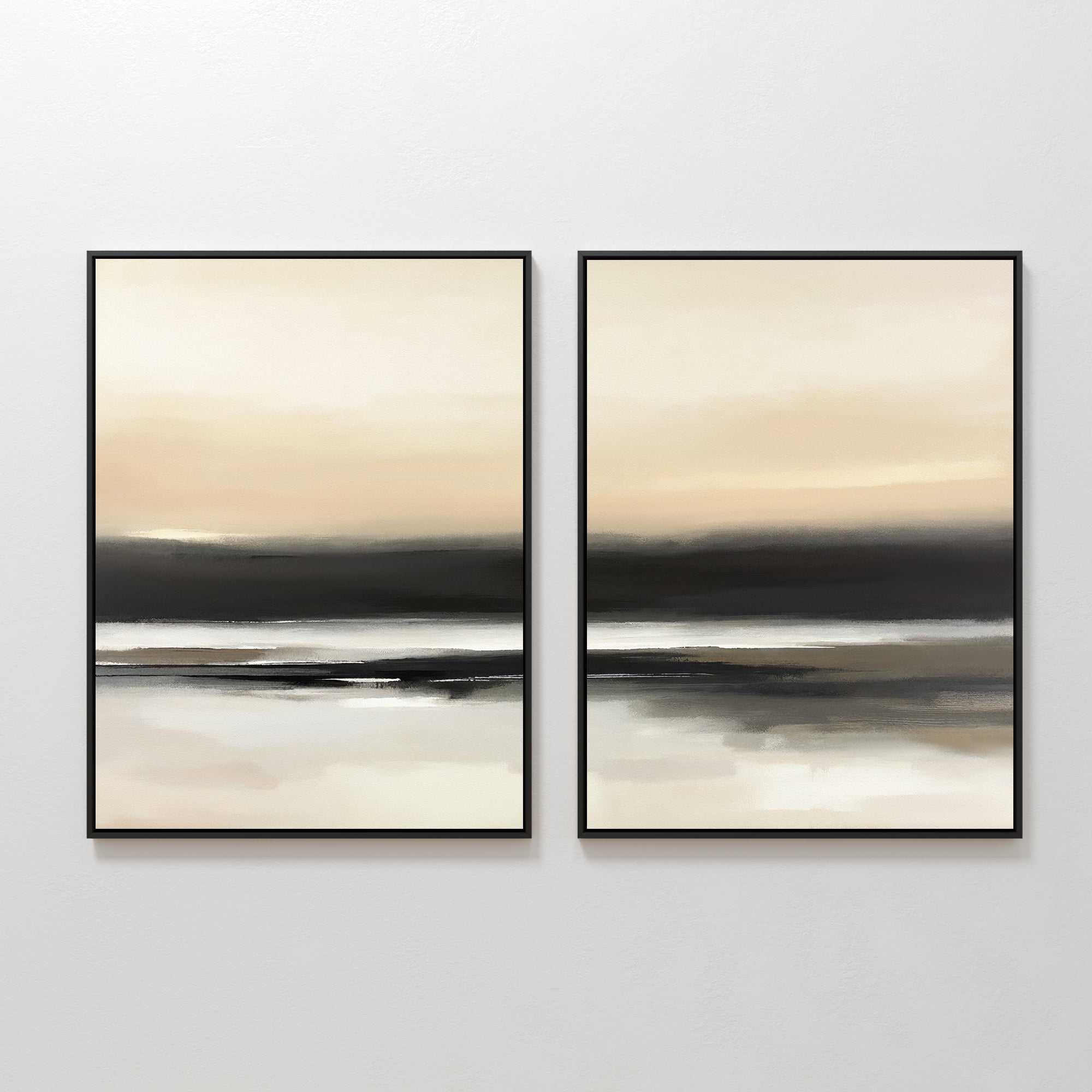 The Quiet Shoreline - Set Of 2 features abstract coastal prints with soft beige, cream, gray, and black layers. Displayed in black frames on a white wall, they evoke serene water scenes and create a calming arrangement.