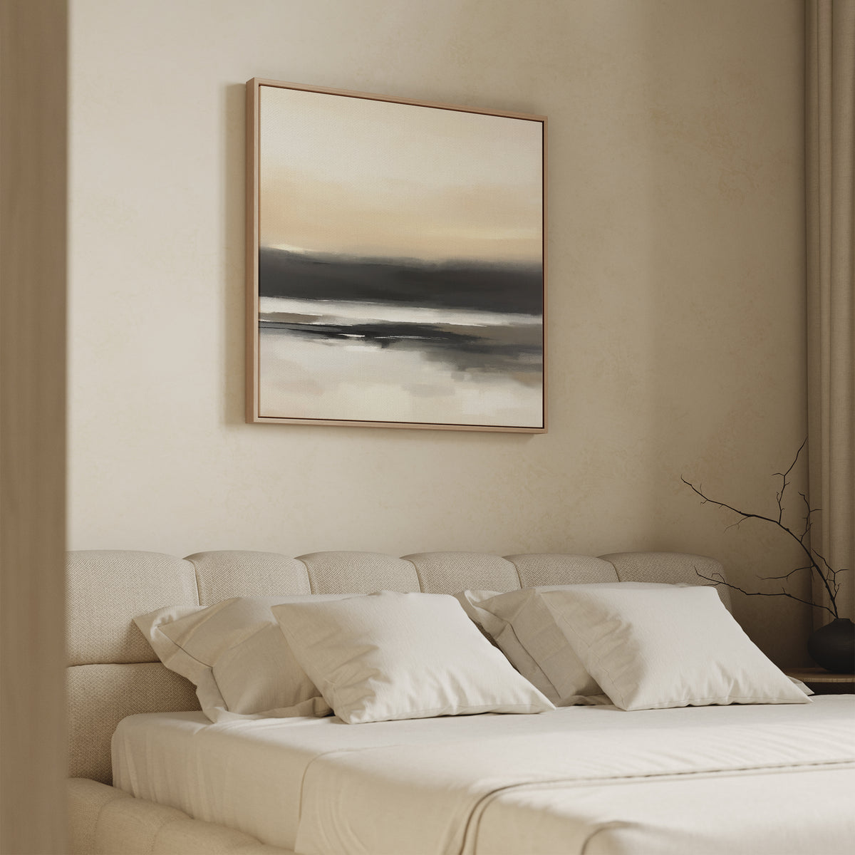 A minimal bedroom features a beige upholstered bed with white bedding and pillows. Above the bed hangs the Quiet Shoreline Canvas Art - Square in soft neutrals. A bare branch sits on the side table, while beige curtains frame this serene space.