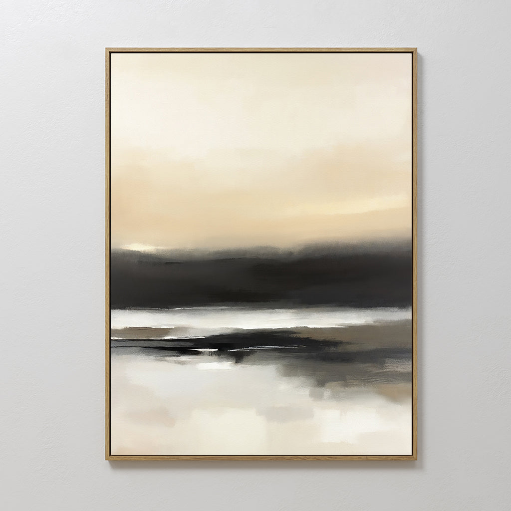 The Quiet Shoreline Canvas Art - Vertical features soft, blended tones of beige, cream, gray, and black to evoke a calm coastal landscape. This serene framed art is displayed on a plain light-colored wall.