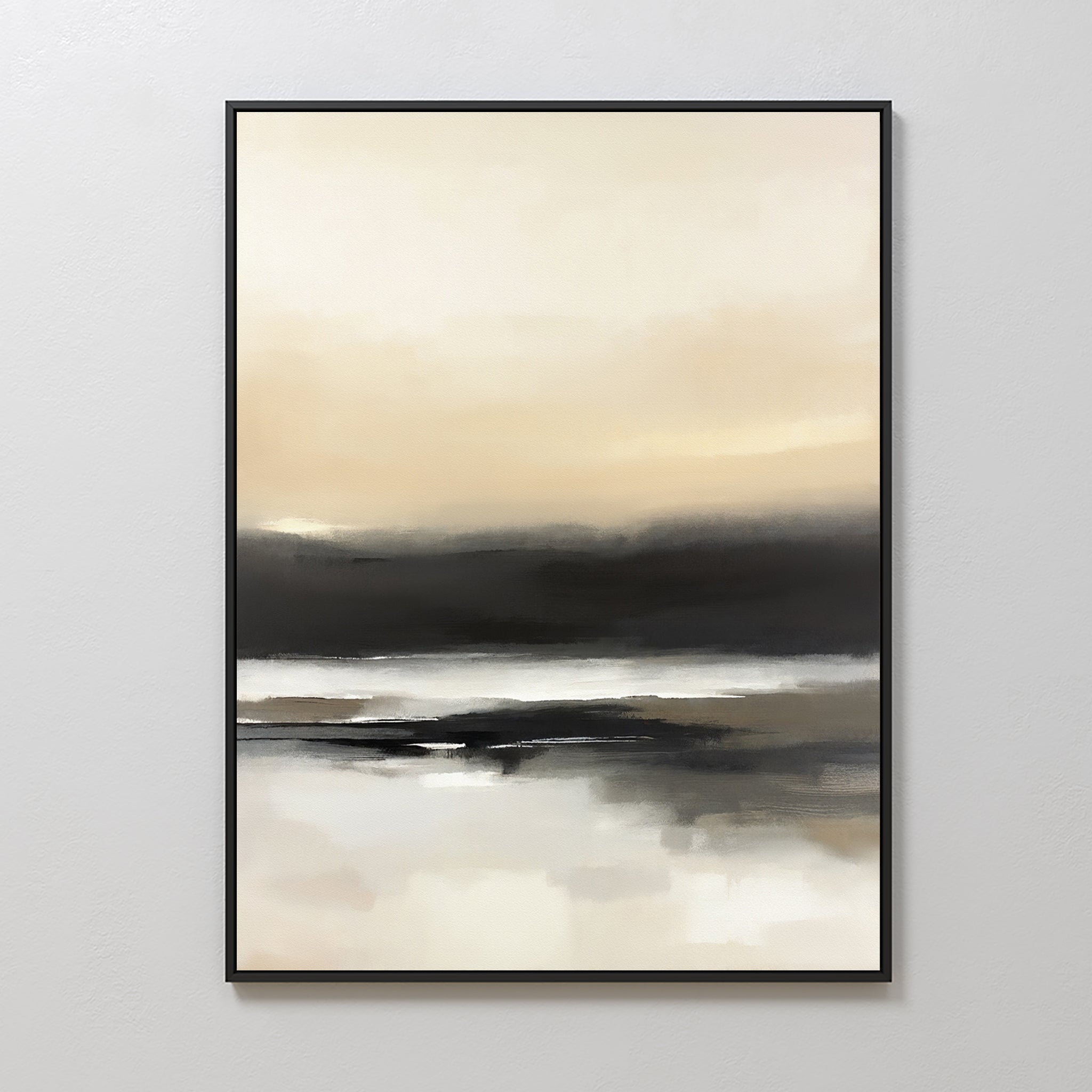 The Quiet Shoreline Canvas Art - Vertical features abstract coastal imagery with soft beige, cream, white, and dark gray layers, evoking a misty landscape. This serene framed piece is displayed on a light-colored wall.
