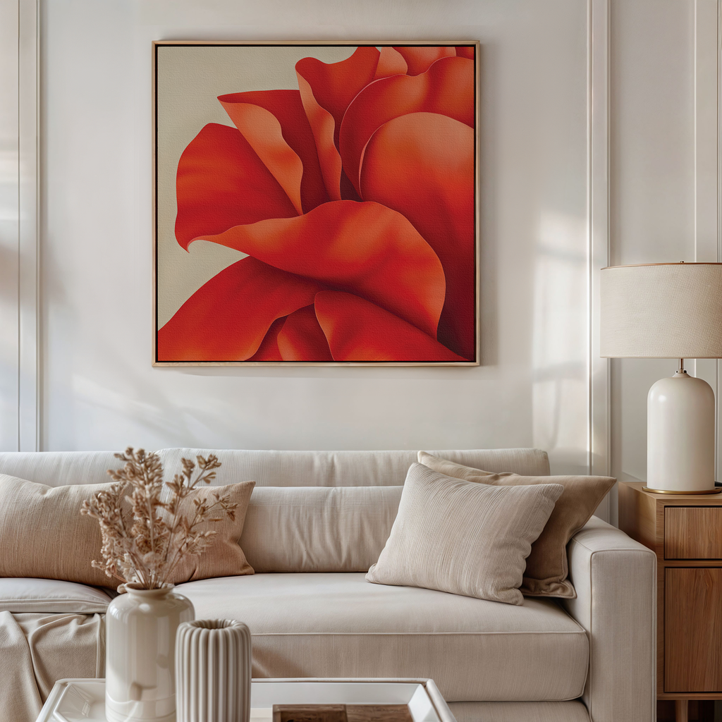 A modern living room with a beige sofa, light neutral pillows, a side table with a lamp, dried flowers in a vase, and Red Elegance Abstract Canvas Art—a striking minimalist wall piece of a large abstract red flower above the couch.