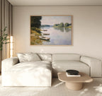 A modern living room features a light beige sectional, wooden coffee table, and the River Tranquil Canvas Art - Horizontal above the sofa, filling the Nordic Park-inspired space with serene river vibes and natural light.