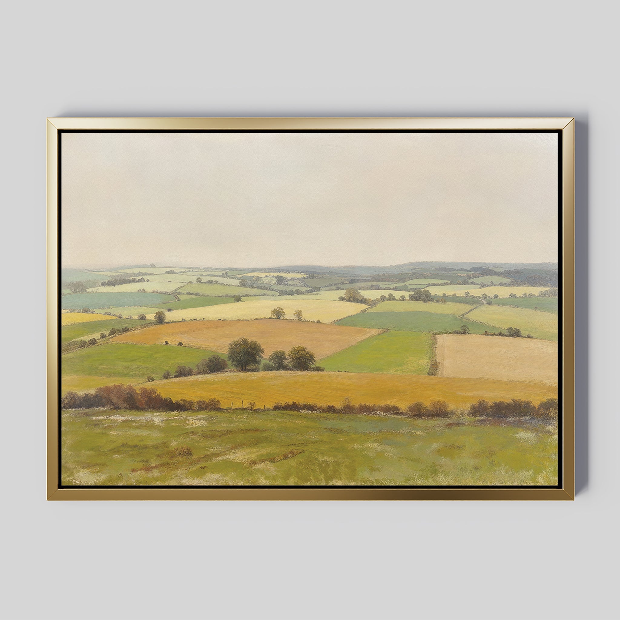The Rolling Fields Canvas Art - Horizontal features a pastoral landscape with green and yellow fields, scattered trees, and distant hills under an overcast sky, shown against a light gray background.