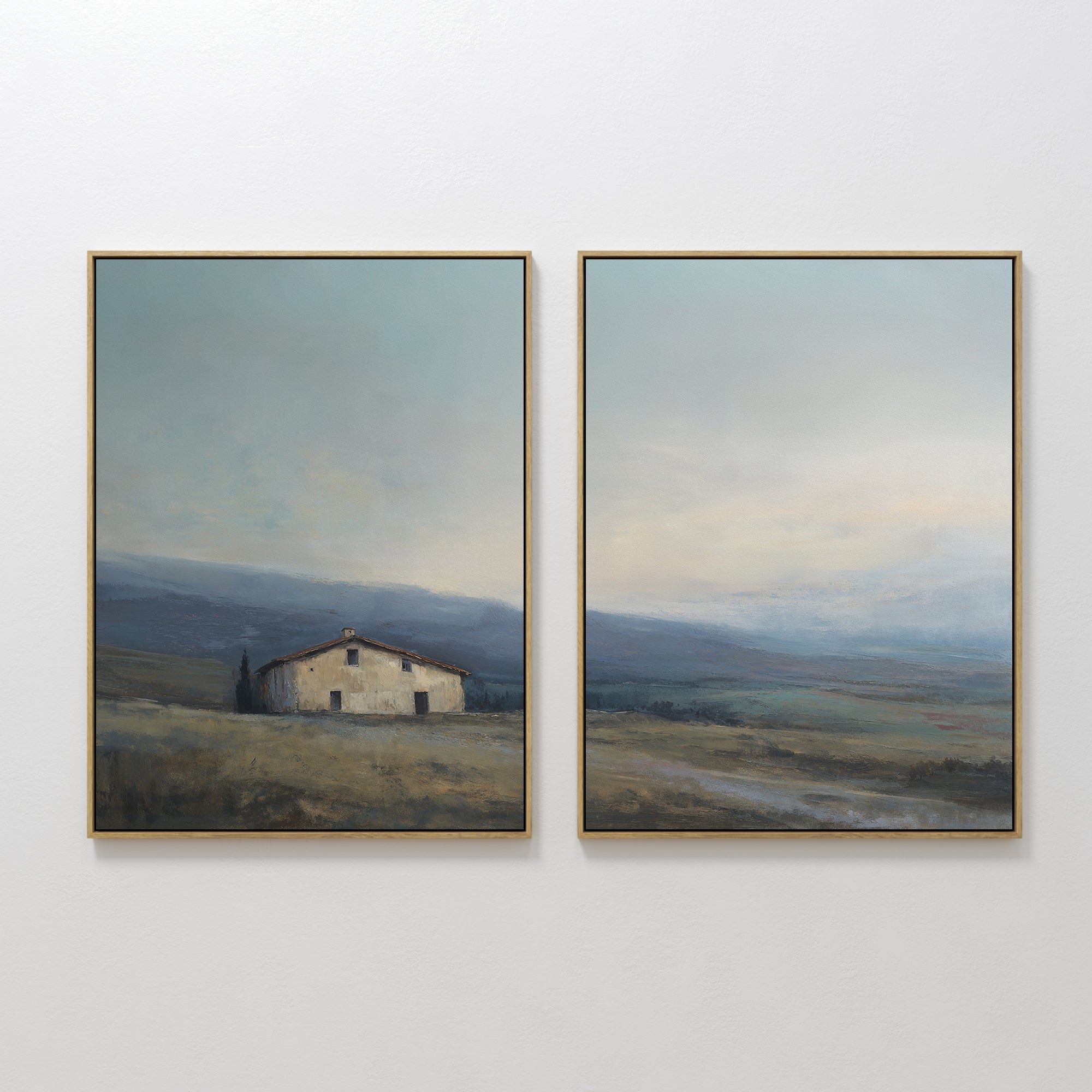 The "Rustic Solitude - Set of 2" features framed landscape wall art: one print depicts a rustic farmhouse in open fields with distant hills, while the other continues the serene décor with wide skies and rolling terrain.