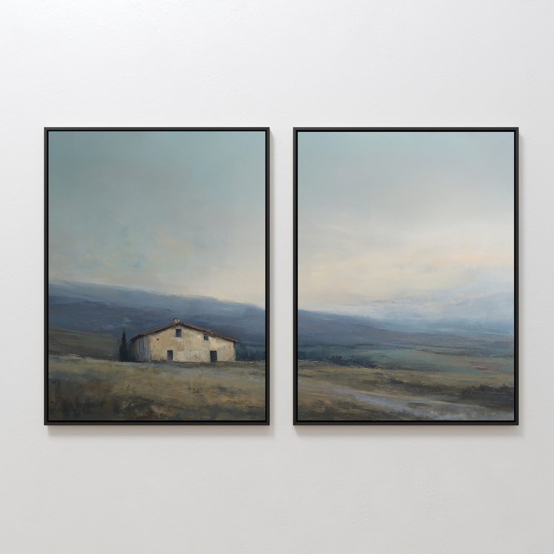 The Rustic Solitude - Set of 2 features framed wall art, each depicting an old house, grassy fields, distant hills, and a soft cloudy sky in muted earthy tones for a charming farmhouse look.