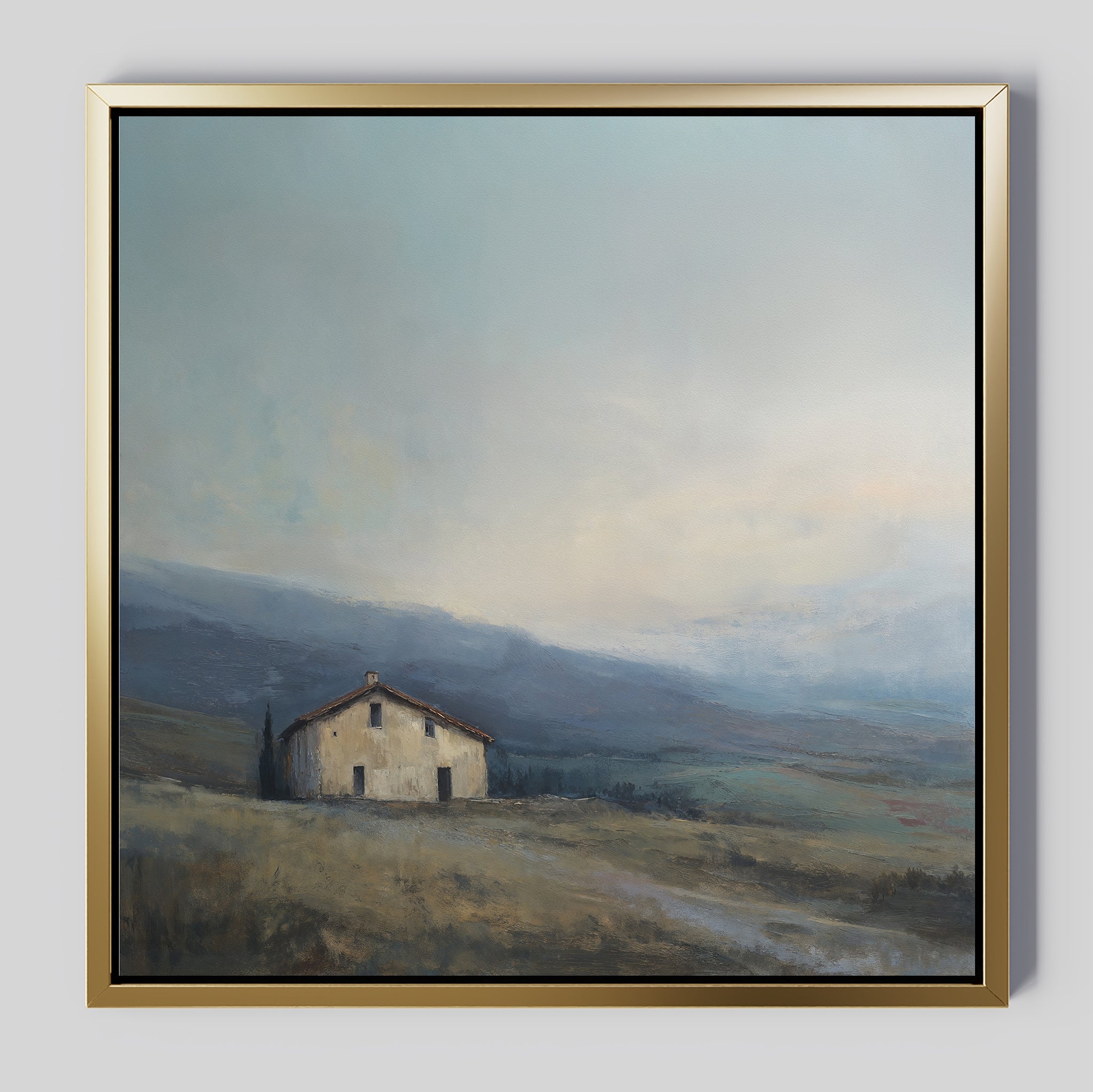 The Rustic Solitude Canvas Art - Square features a solitary house on a grassy hill beneath a cloudy sky and distant mountains. Muted, soft tones create calm, making it ideal serene landscape decor for any room.