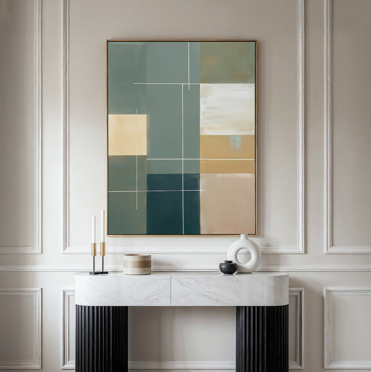 A modern console table with minimalist decor sits against a white-paneled wall beneath the Sage Compartments Canvas Art – Vertical, which features geometric shapes in muted green, beige, blue, and cream tones.