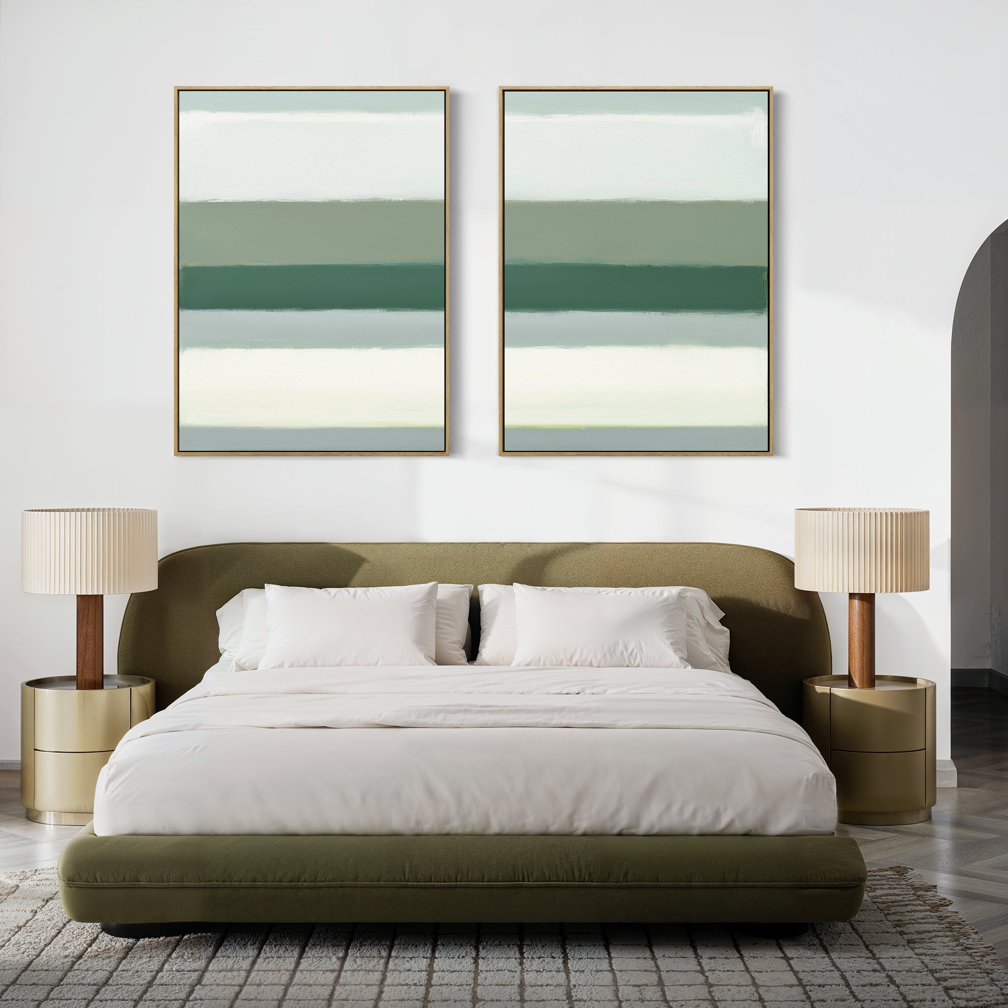 A modern bedroom features a green upholstered bed with white bedding, two beige round nightstands topped with matching lamps, and the Sage Gradient - Set Of 2 abstract prints displayed above the headboard.