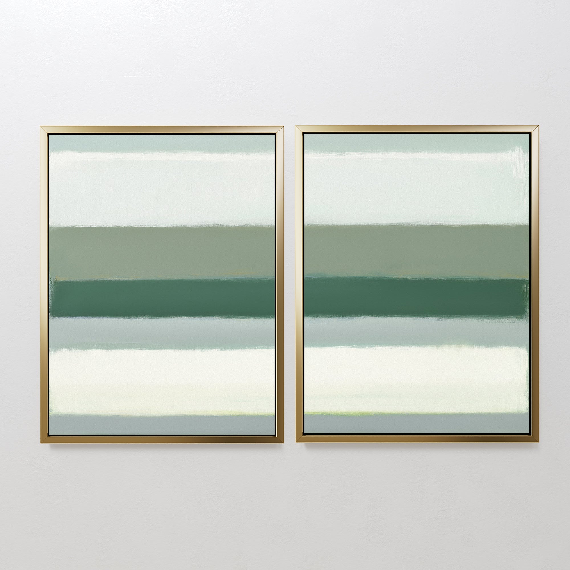 The Sage Gradient - Set Of 2 features framed abstract prints with horizontal bands in calming sage green, gray, and white tones, creating a soft, minimalist look when hung side by side on a white wall.