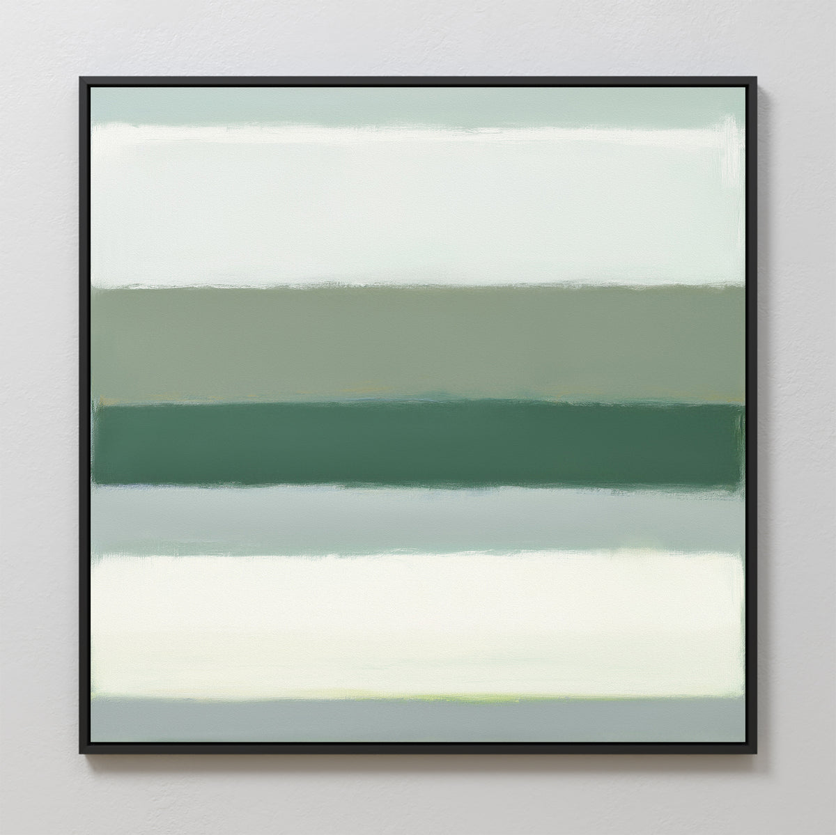 The Sage Gradient Canvas Art - Square showcases horizontal bands of soft green, teal, and white with blurred edges in a calming abstract style. A thin black frame adds elegance, making it ideal for display on a light-colored wall.