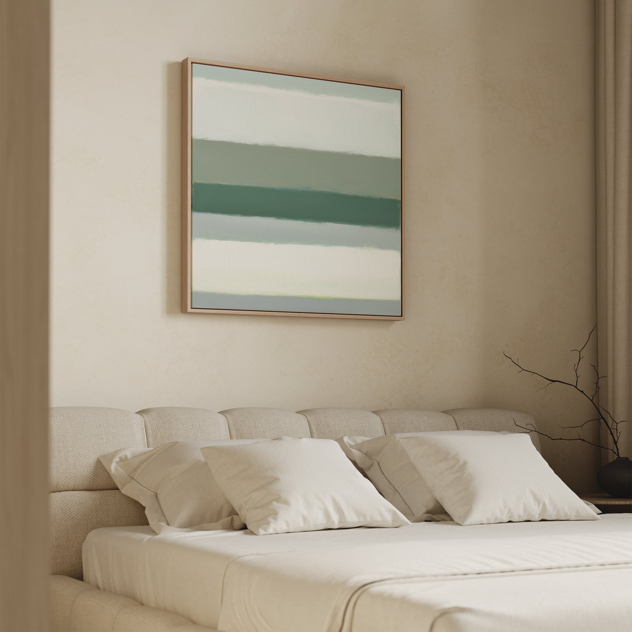 Minimalist bedroom featuring a beige tufted bed with white bedding and pillows. Above the bed hangs the Sage Gradient Canvas Art - Square, displaying calming horizontal green and white stripes. A bare branch decorates the side table.