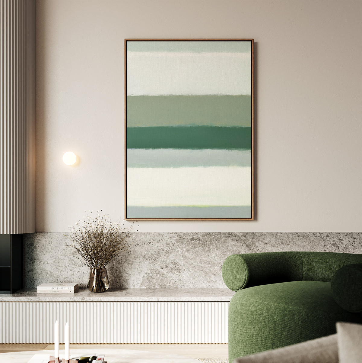 A modern living room with a green curved sofa, the Sage Gradient Canvas Art - Vertical featuring soothing abstract stripes, a minimalist wall light, a vase with dried branches, and neutral-toned decor.