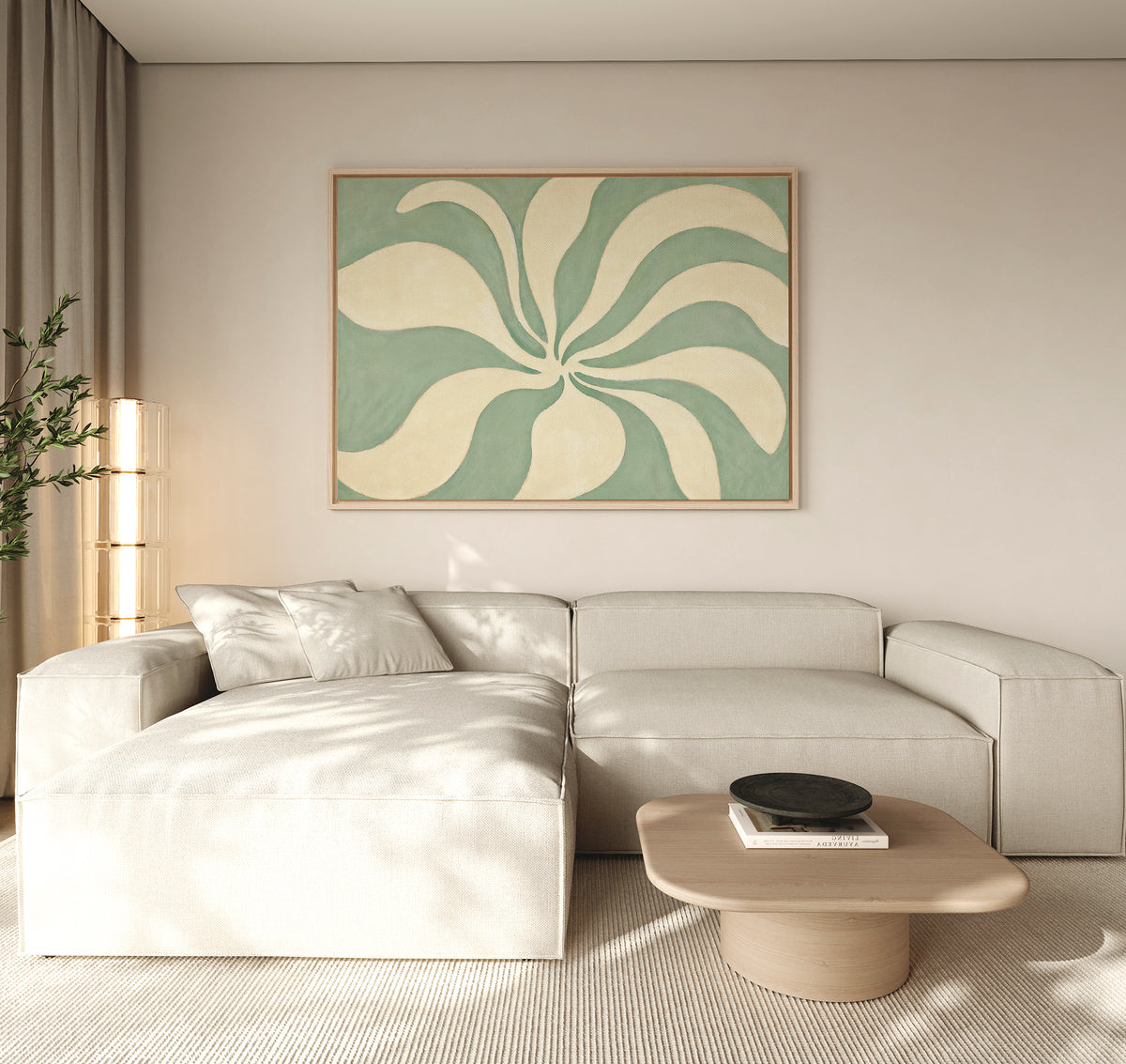 A modern living room with a light beige sectional sofa, a wooden coffee table with books and a bowl, and the Sage Meditation Canvas Art - Horizontal displayed above the sofa. Light fills the space through a window with beige curtains.