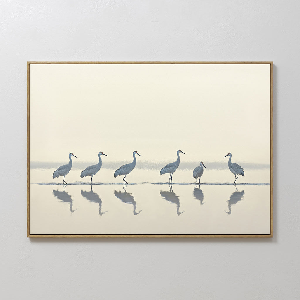 The Sandhill Procession Canvas Art - Horizontal features six graceful cranes in shallow water with their reflections, set against a gentle background—ideal for adding serene elegance to any wall.