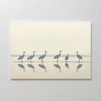 Sandhill Procession Canvas Art - Horizontal features six elegant cranes standing in shallow water with mirrored reflections and a soft, muted background—creating serene wall art to enhance any space.
