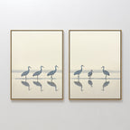 The Sandhill Procession - Set Of 2 features minimalist wall art prints of herons in soft neutral tones. Displayed side by side, these calming artworks bring serene decor to any white wall.