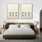 A modern bedroom featuring a green upholstered bed, white bedding, beige nightstands with matching lamps, and the Sandhill Procession - Set Of 2 wall art above the bed. The calm, minimalist design creates serene home decor.