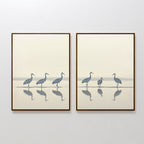 The Sandhill Procession - Set Of 2 features framed prints of heron silhouettes in shallow water with reflections and a soft gradient background, creating calm, minimalist wall art—ideal for serene home decor.