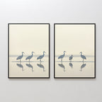 The Sandhill Procession - Set of 2 features framed minimalist prints: the left shows four cranes in a line, the right displays three cranes and a smaller bird, all standing in shallow water with their reflections—perfect serene home decor.