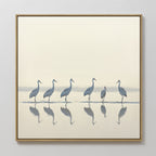 The Sandhill Procession Canvas Art - Square features six cranes standing in shallow water, their reflections visible against a soft neutral backdrop—perfect for adding serene elegance to any Nordic Park-inspired space.
